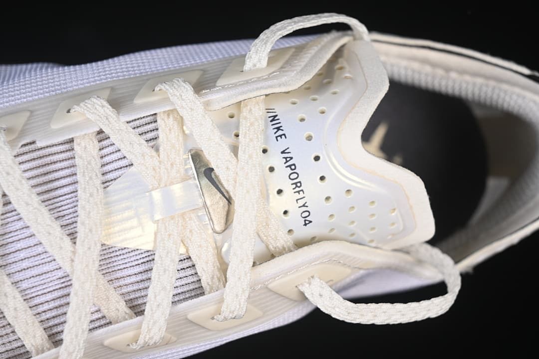 Close-up of the laces and tongue marked Nike Vaporfly 04