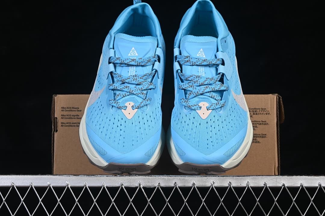 Front view of the pair showing the blue uppers, lace closures and contrasting midsoles.