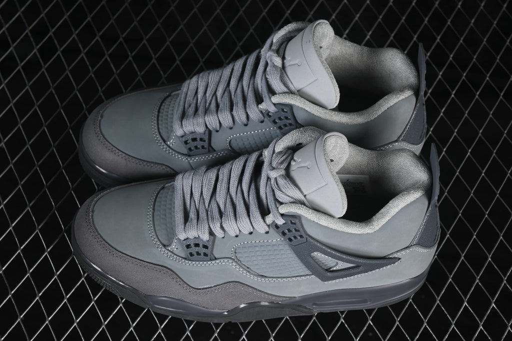 Angled overhead view of a grey Air Jordan 4 Retro SE pair.
