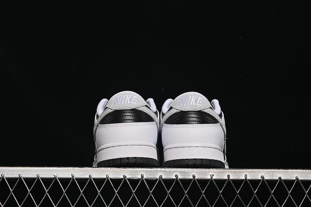 Rear view of both sneakers showing the heel panels and tabs