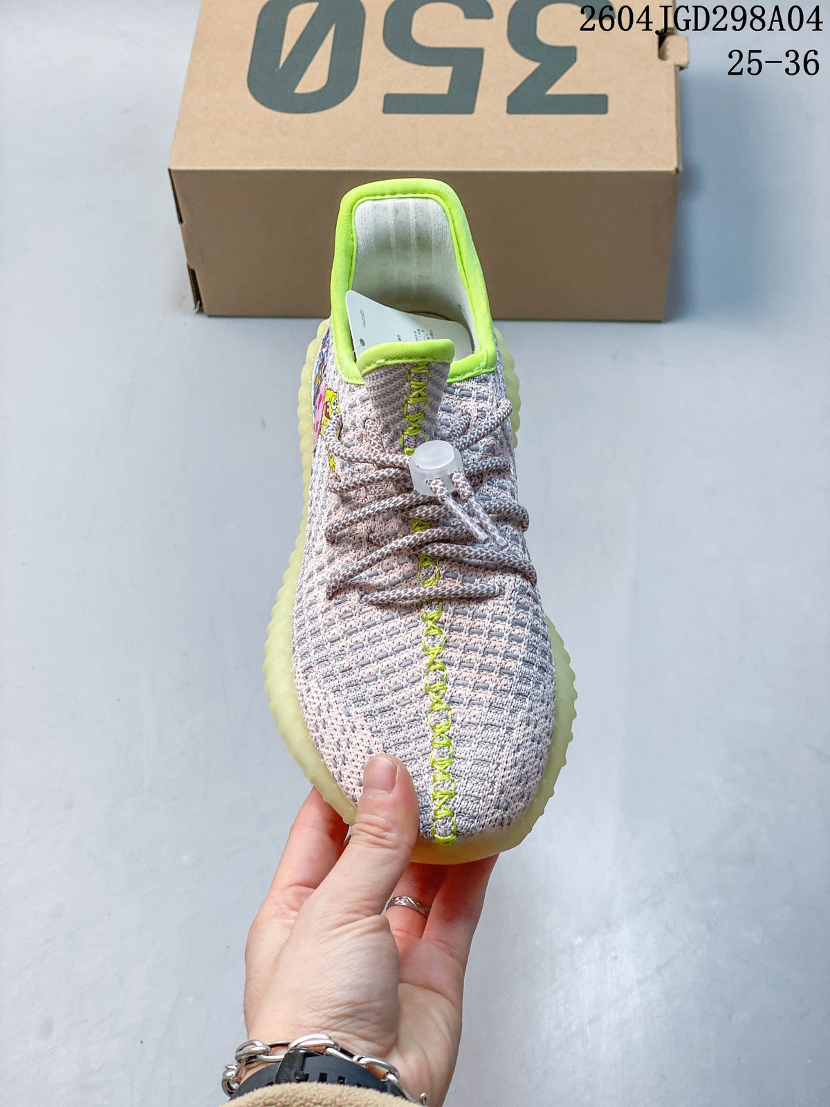Front view highlighting the pale upper, lime-green center stitching, and patterned laces.