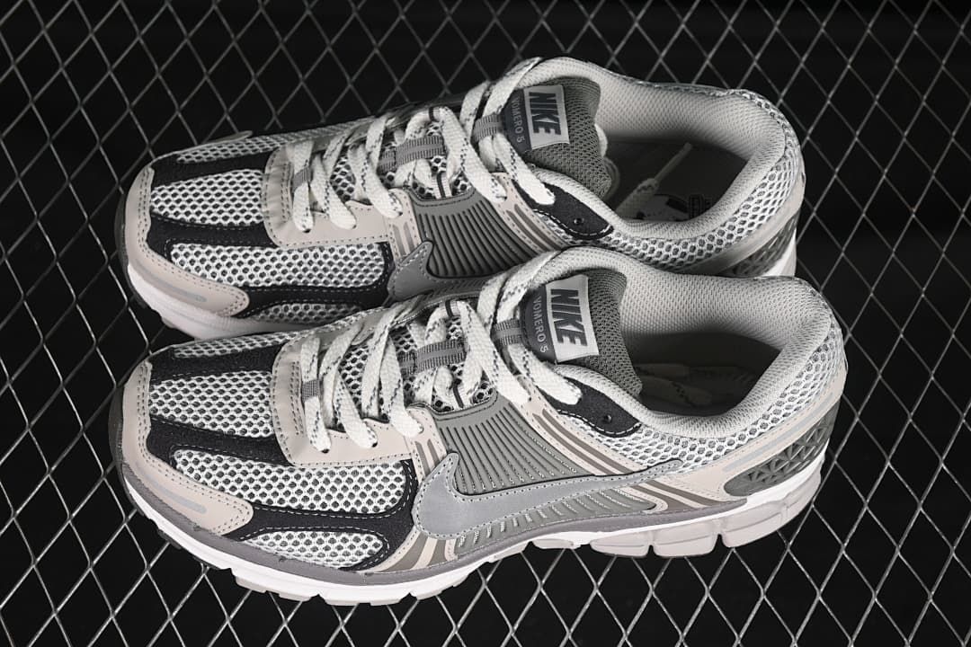 Pair of Nike Zoom Vomero 5 SP sneakers in grey, black and off-white.