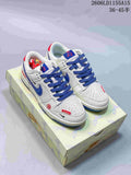 Pair of white and blue low-top sneakers with red accents displayed on a patterned box