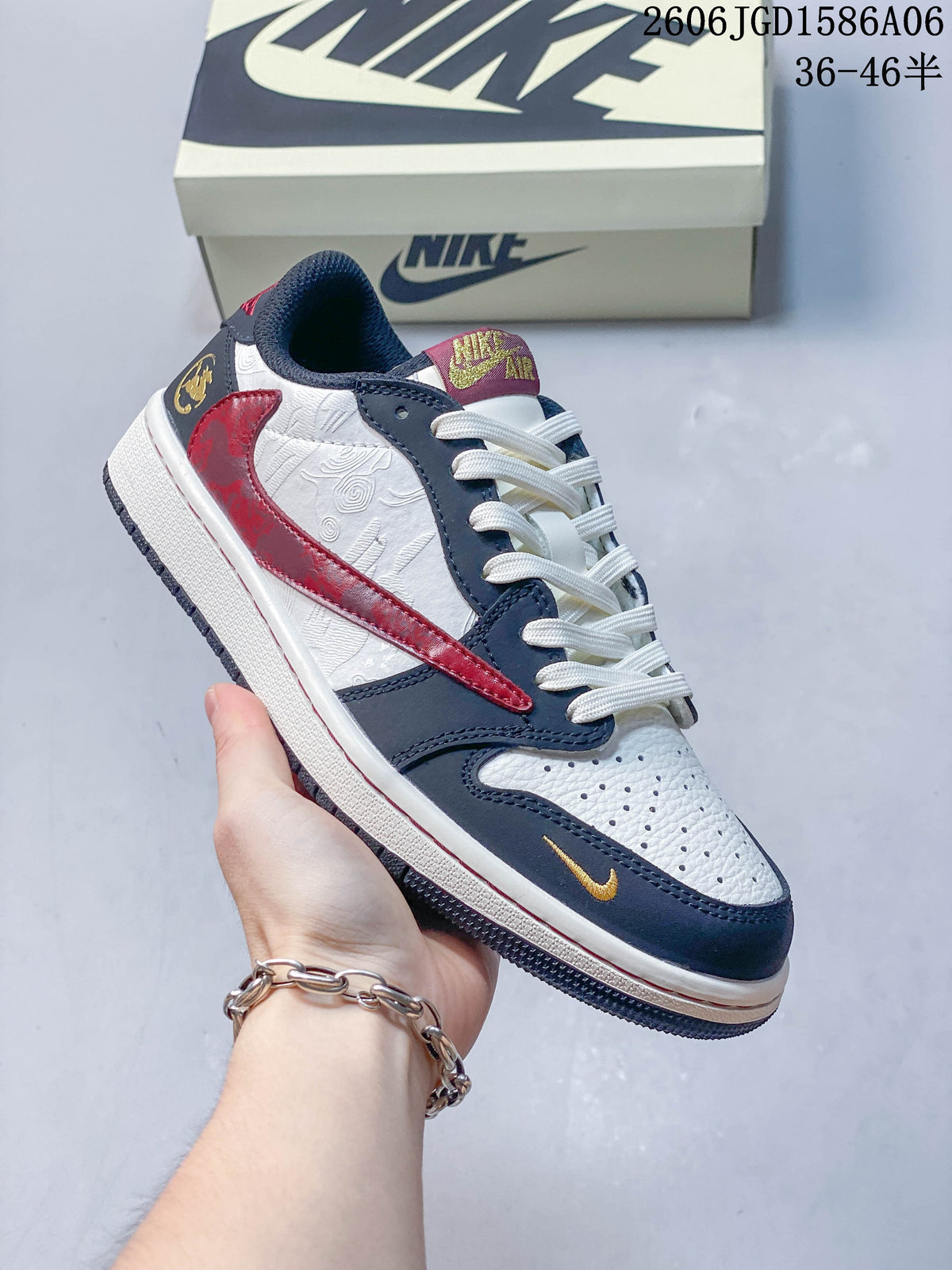 Close view of a white sneaker with navy overlays, red Swoosh detail, and patterned side panel.