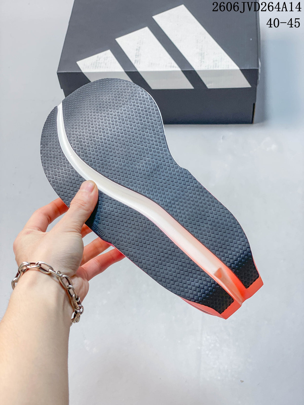 Close-up of the textured outsole on a white Adidas Dropset Elite shoe.
