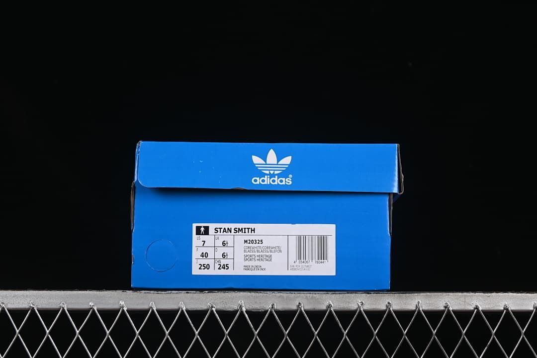 Blue adidas shoe box with a label identifying the Stan Smith M20325 sample.