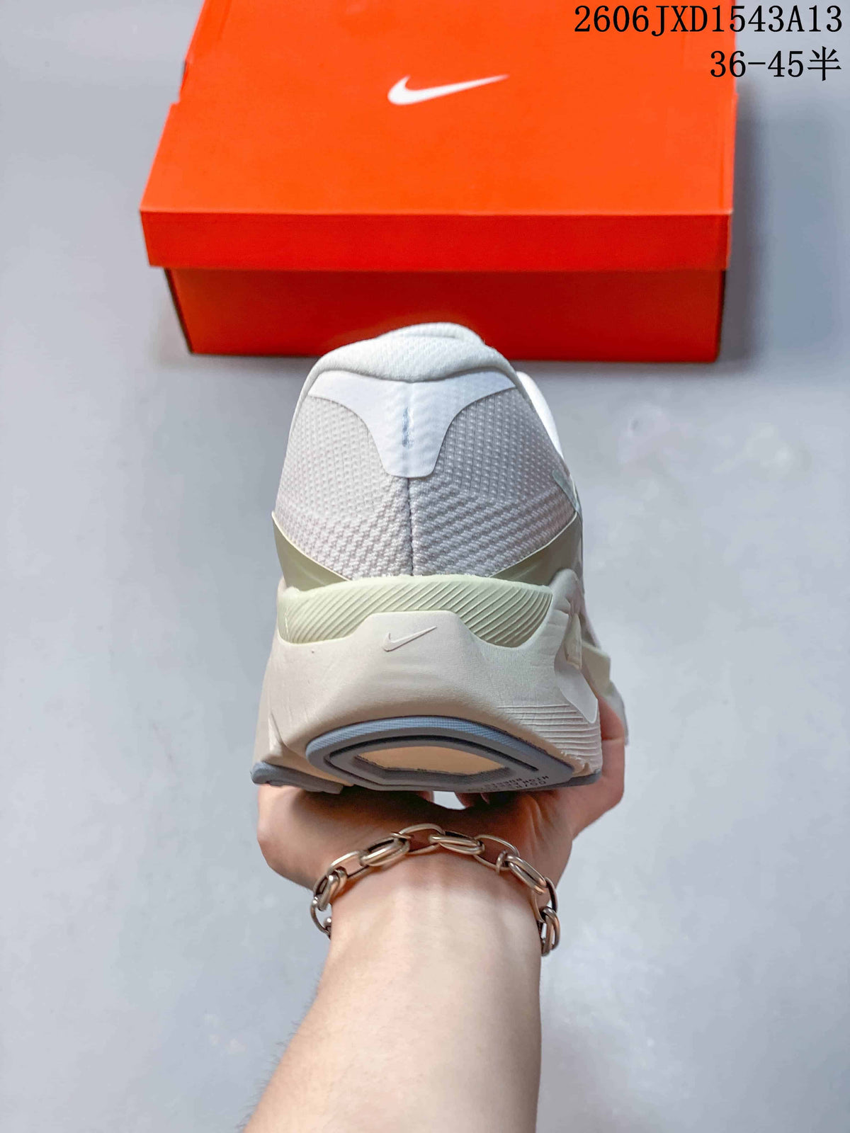 Rear view of the white and pale green Nike Structure Plus running shoe