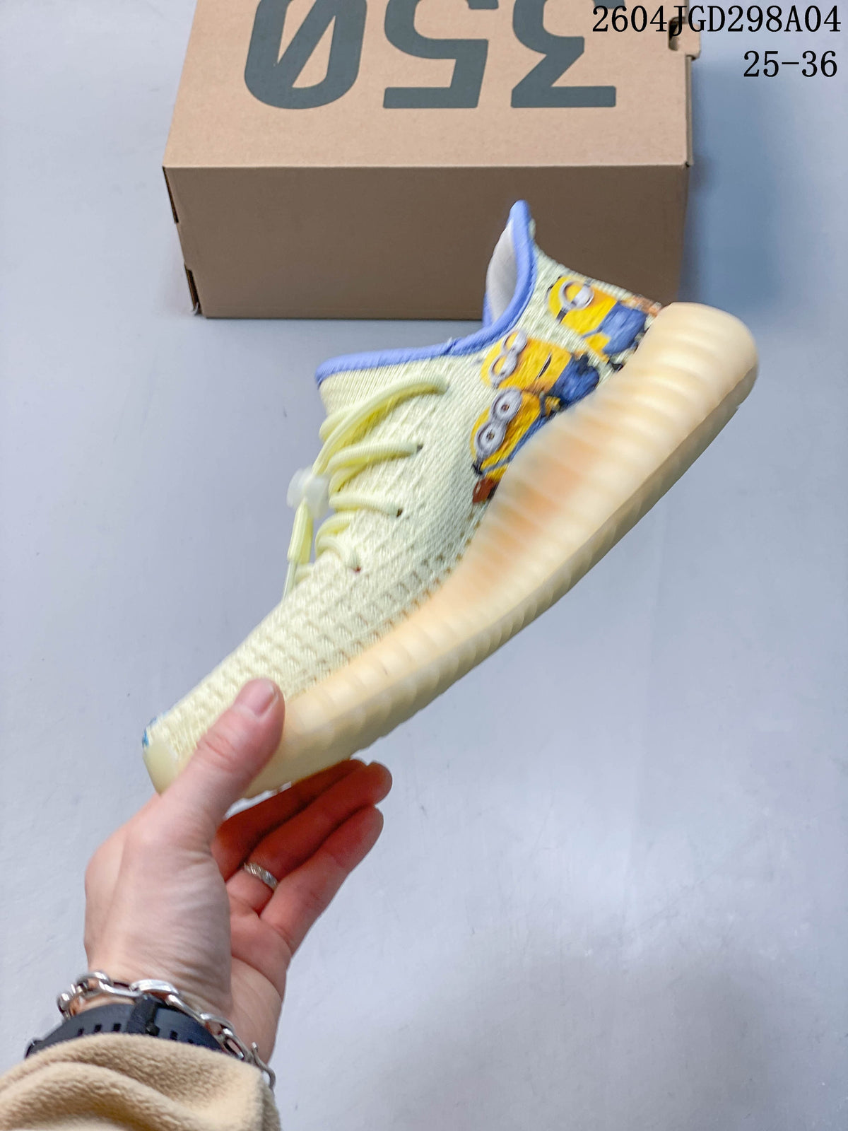 Side view of a cream Adidas Yeezy 350 V2 sneaker with colorful illustrated graphics and blue trim