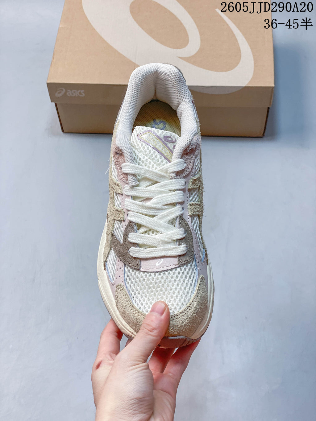 Top view of the sneaker showing white laces, mesh panels, and contrasting overlays.