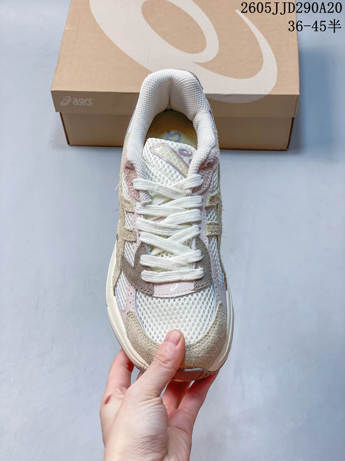 Top view of the sneaker showing white laces, mesh panels, and contrasting overlays.