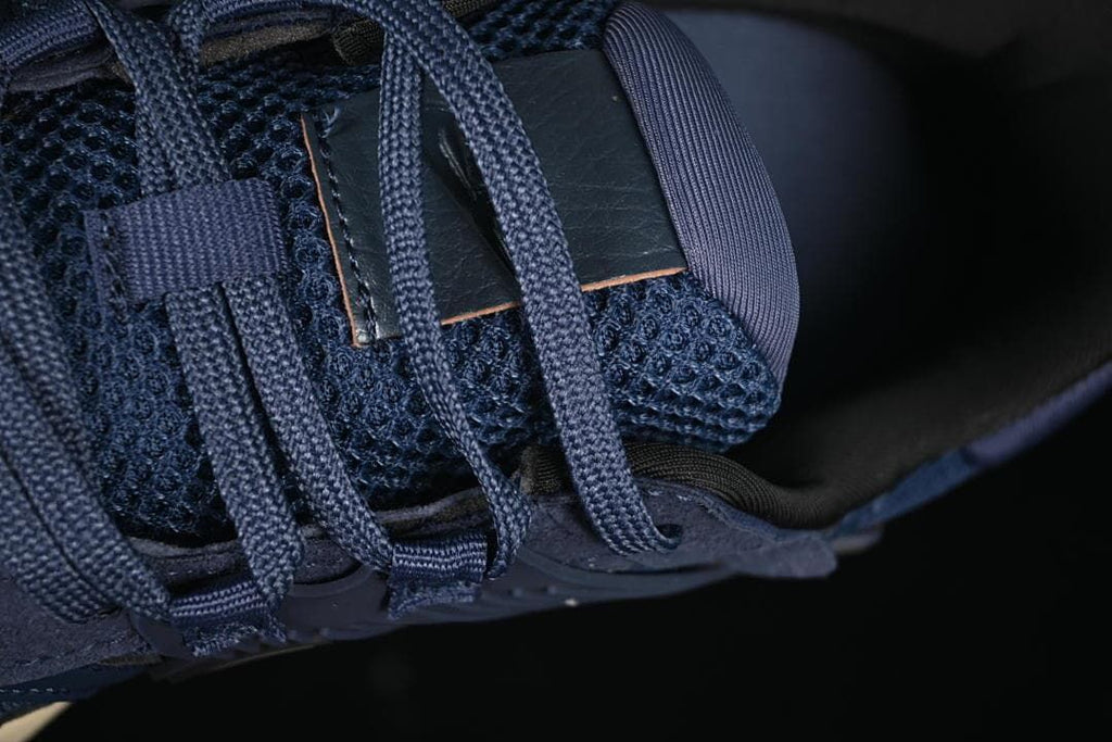 Close-up of navy laces and mesh tongue