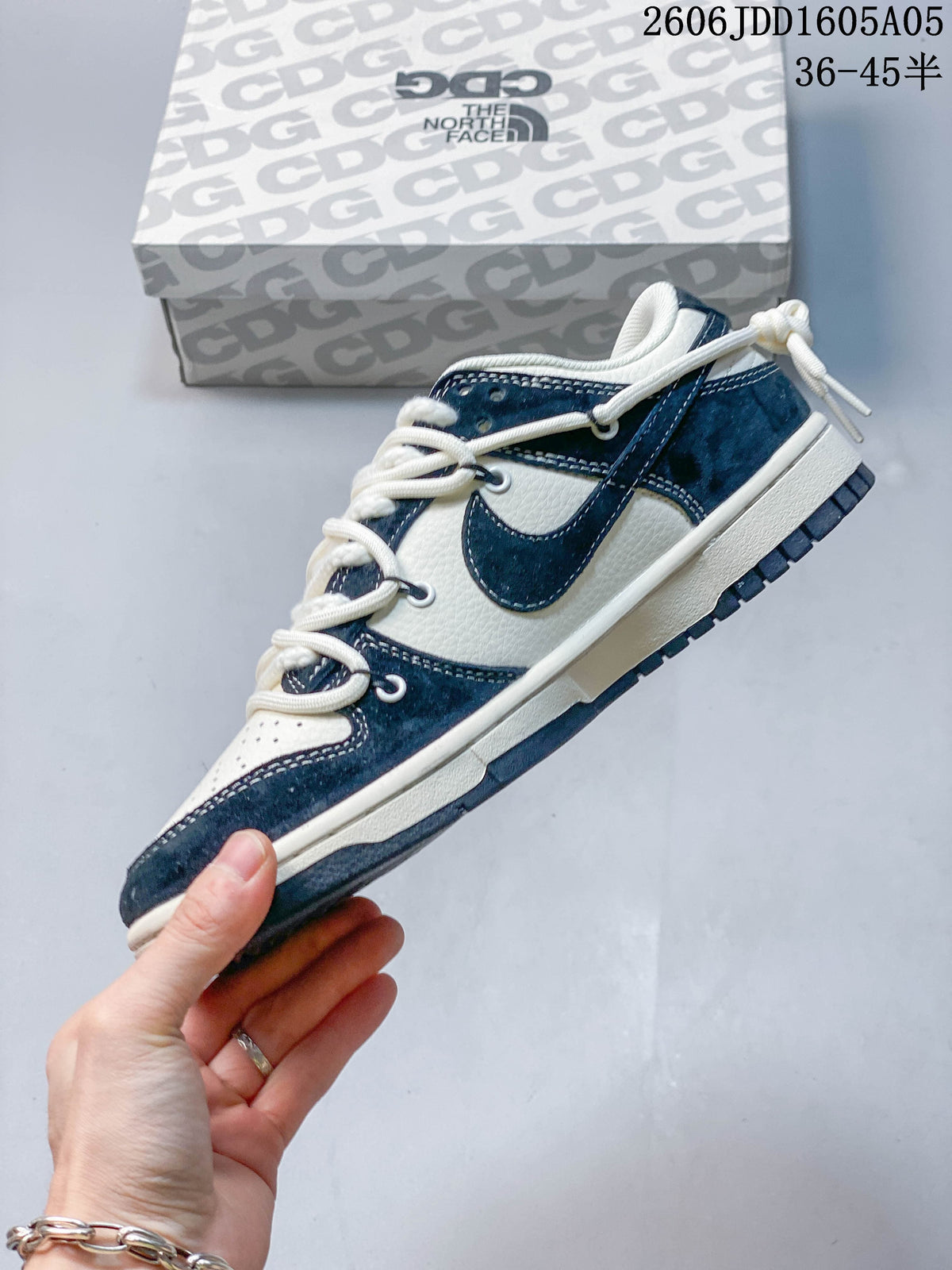 Side profile of the off-white and navy low-top sneaker
