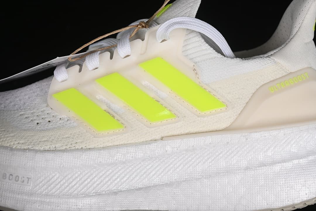 Close-up of the side stripes, laces, and midsole