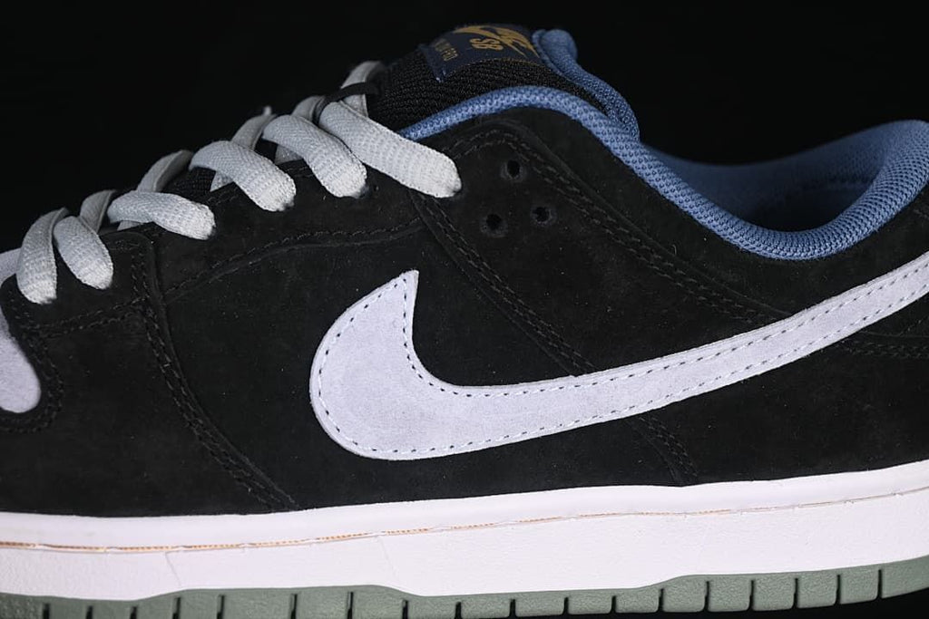 Close-up of the grey Swoosh against the black side panels