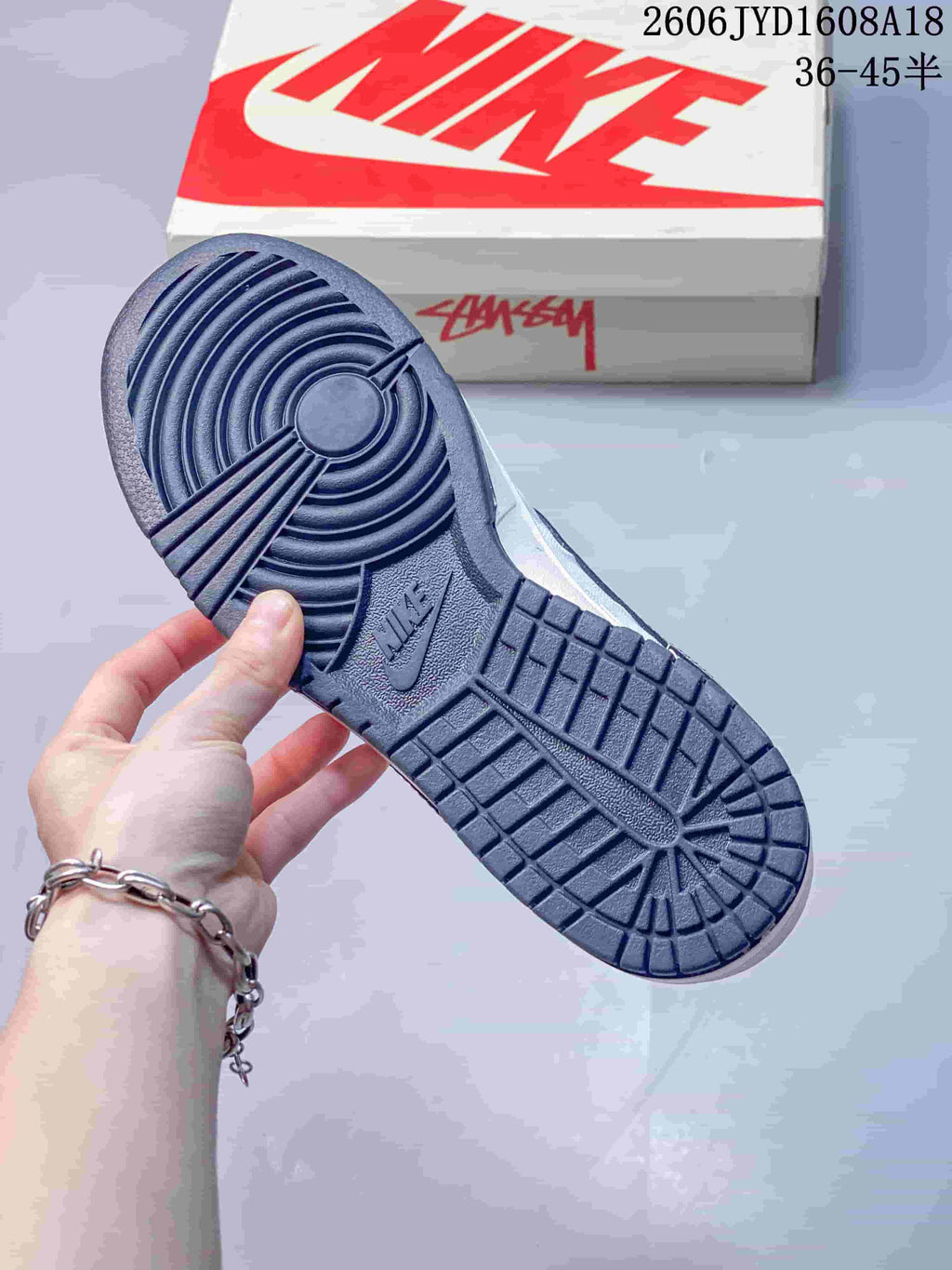 Close-up of the navy outsole and shoe box