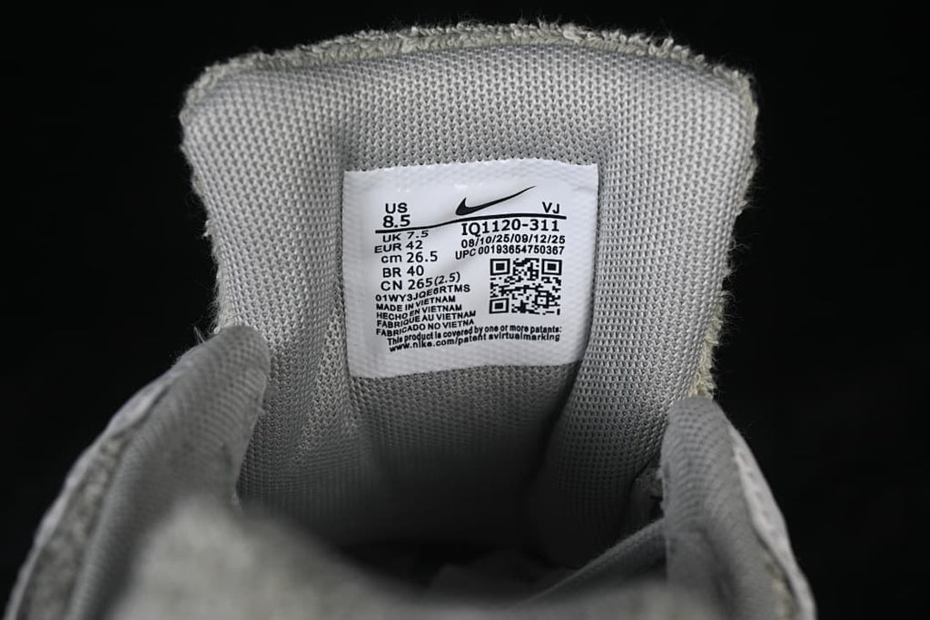 Close-up of the shoe size label showing EU 42 and style code IQ1120-311