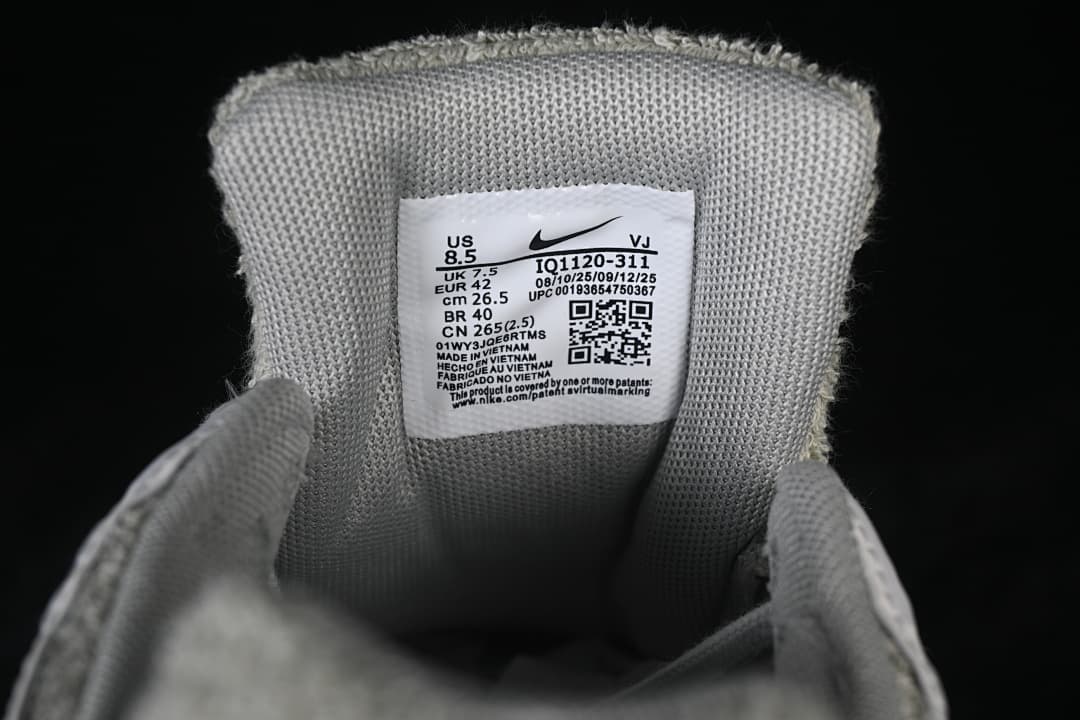 Close-up of the shoe size label showing EU 42 and style code IQ1120-311