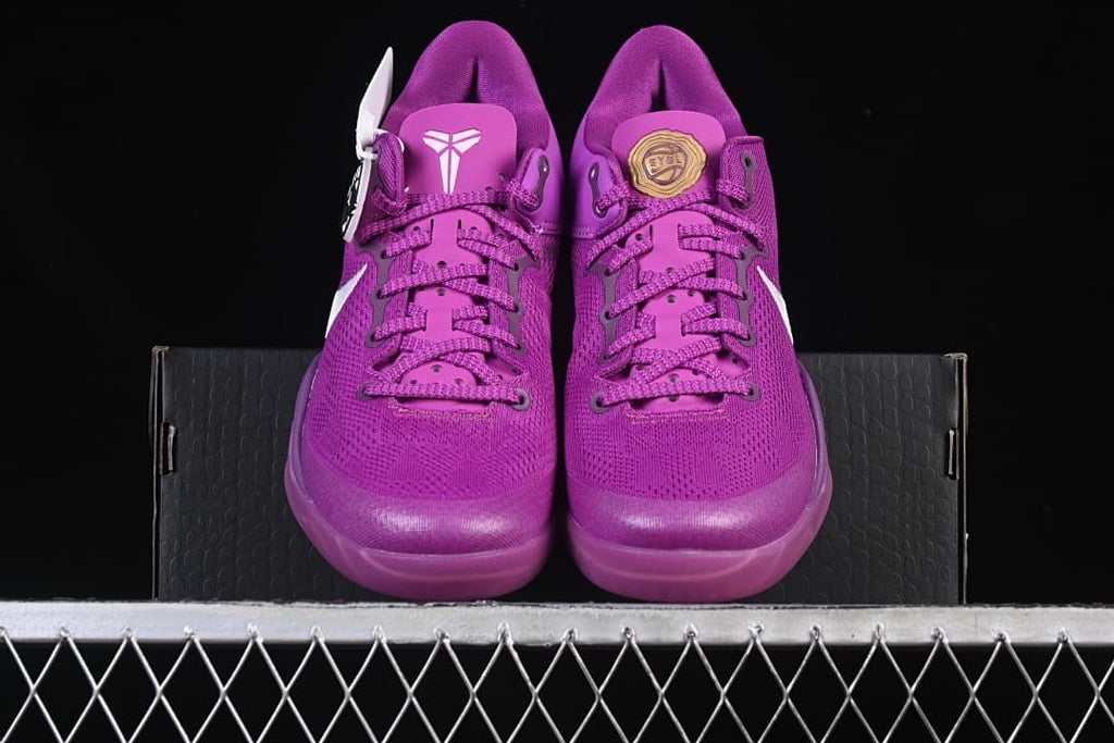 Front view of the purple shoe pair with contrasting tongue details