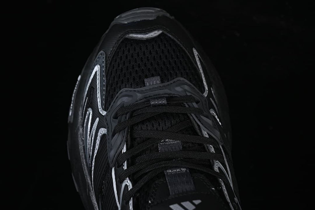 Top view of the black mesh toe and lace-up front