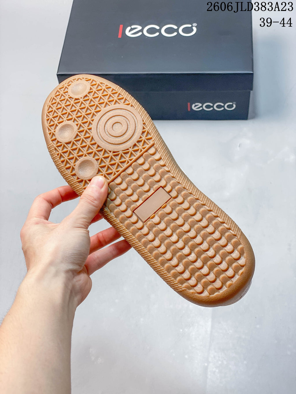 Close-up of the textured gum-colored outsole on an ECCO sneaker