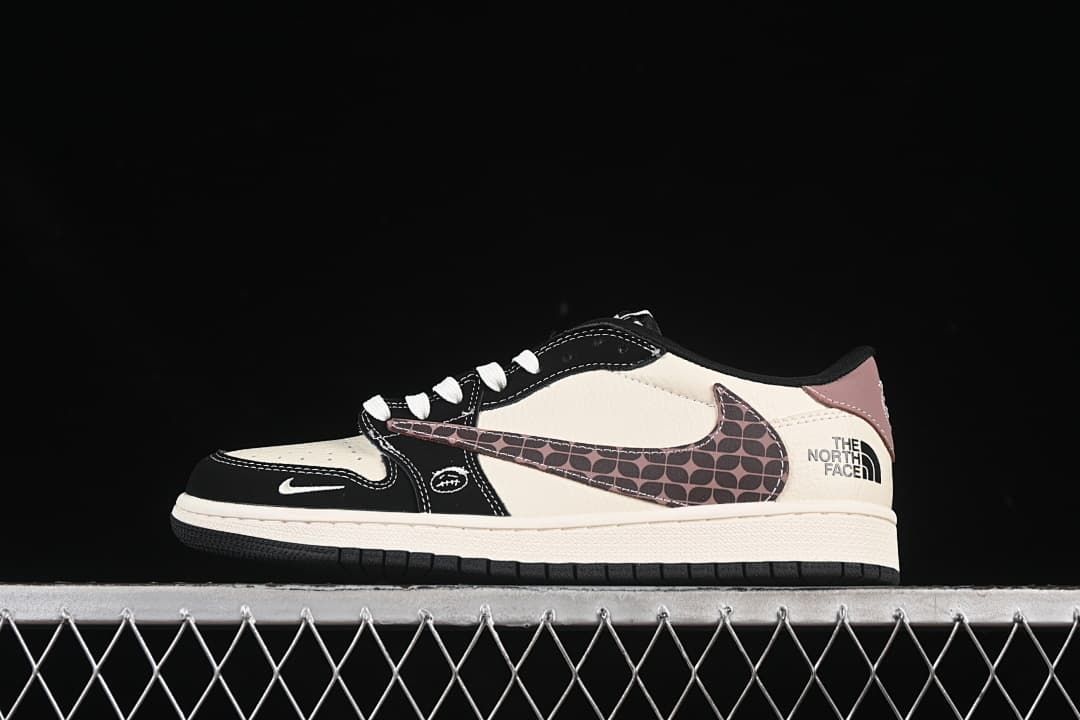 Side view of a cream, black, and mauve low-top sneaker with a patterned Swoosh and The North Face heel text.