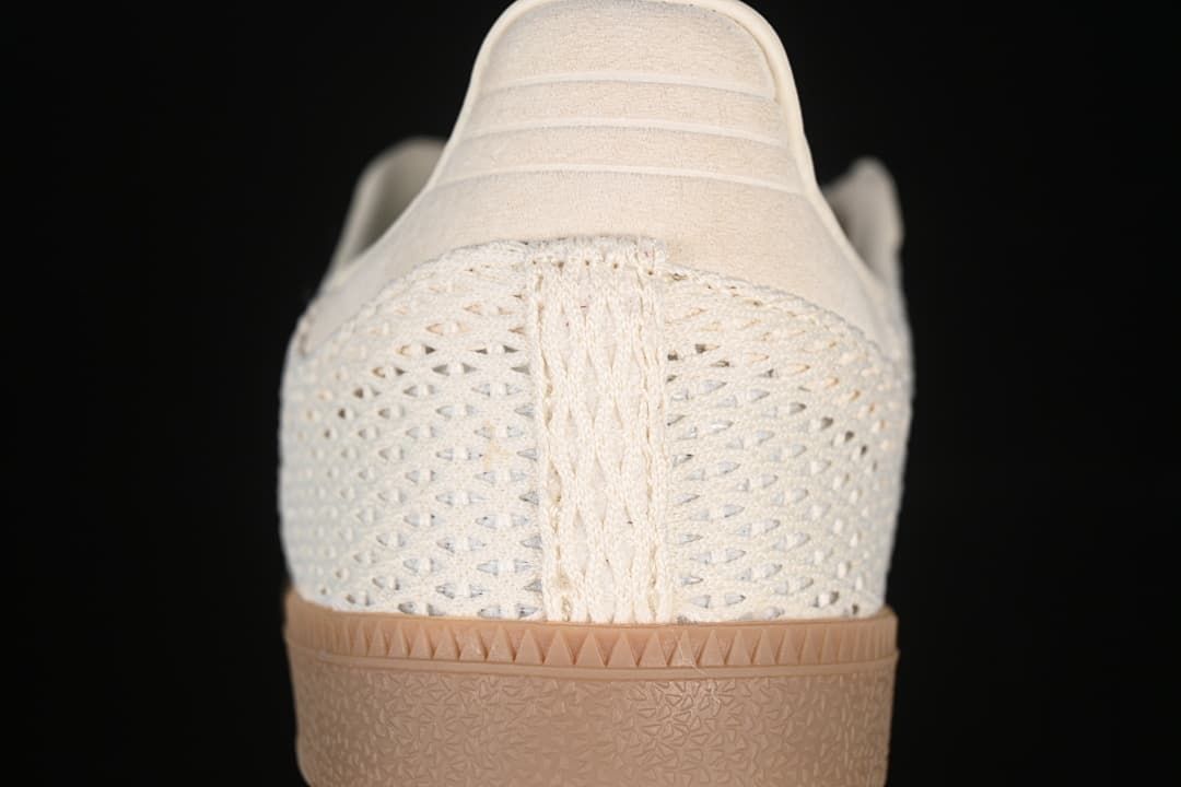 Rear view showing the openwork heel panel and gum-tone outsole.
