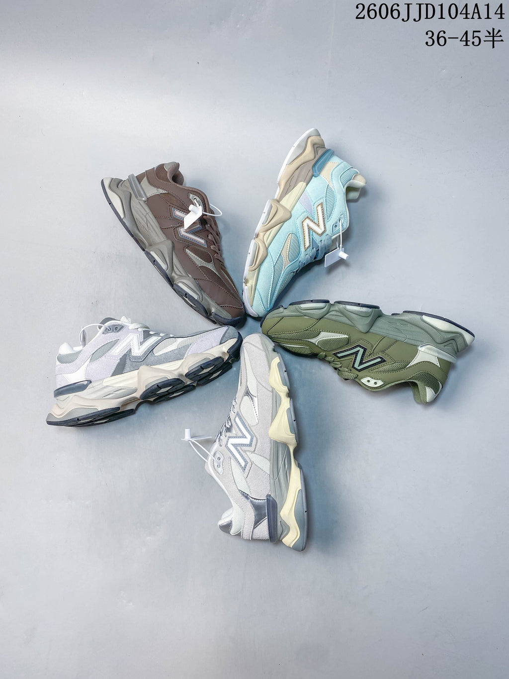 Several New Balance 9060 sneakers in different color combinations arranged together.