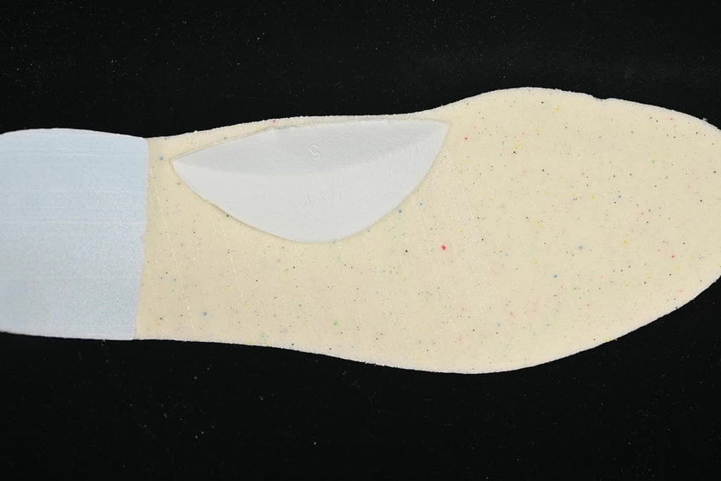 Close-up of the shoe insole showing a light-colored surface