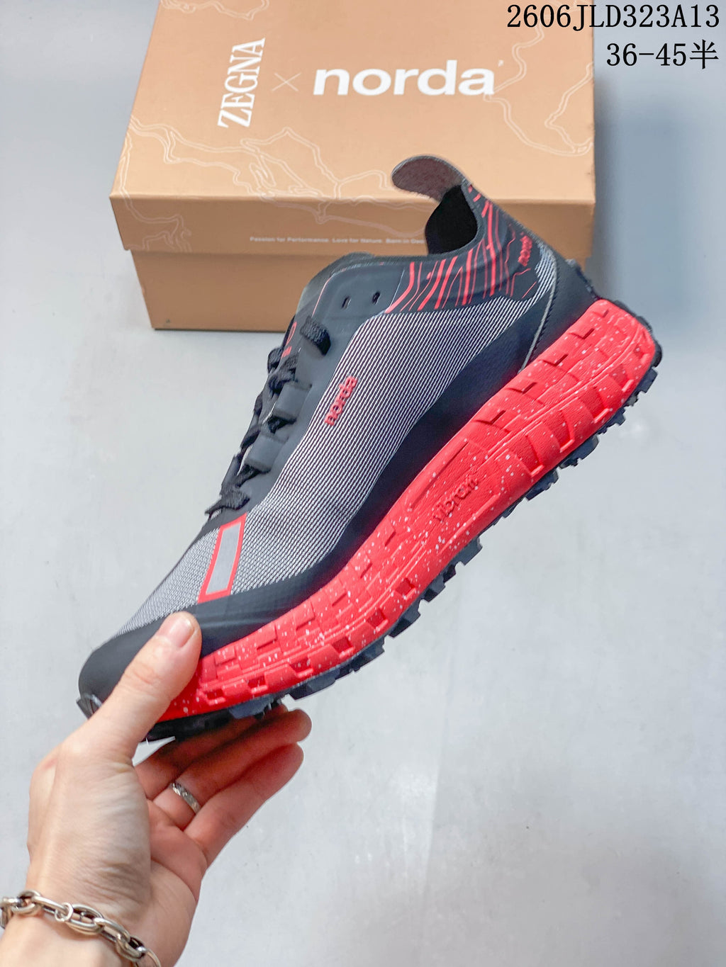 Side view showing the patterned upper and red midsole