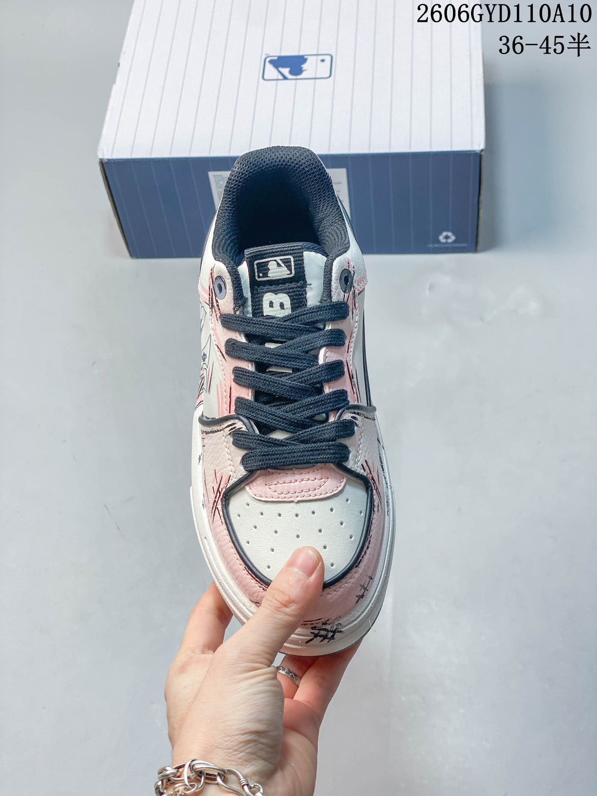 Top view showing the perforated toe panel and navy laces