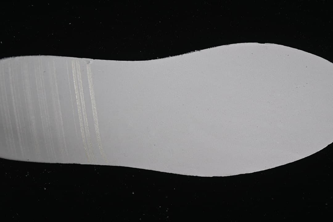 Close-up of the light-colored sneaker outsole