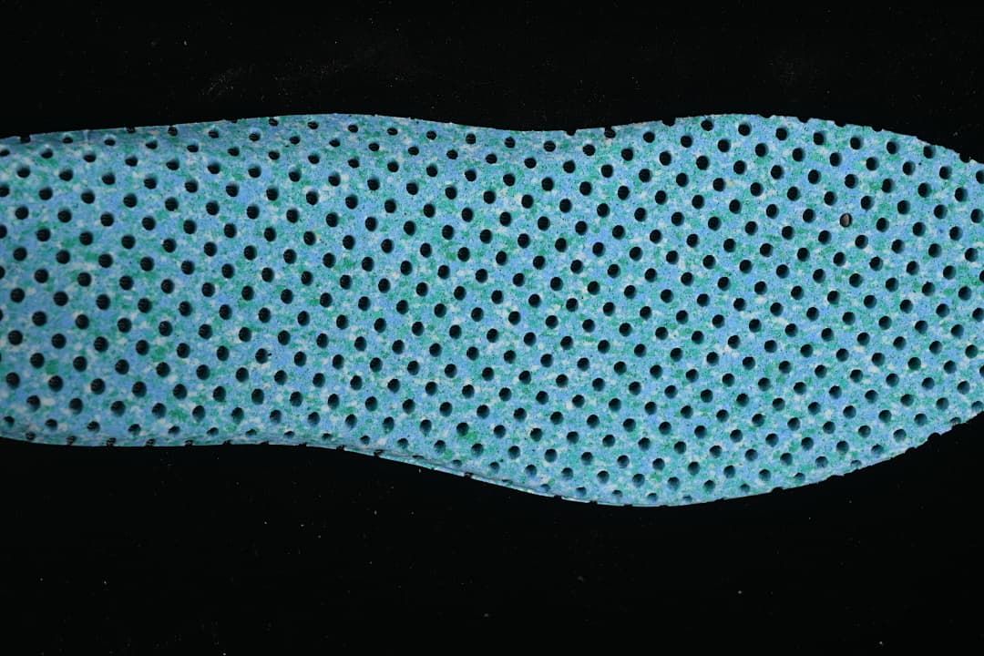 Close-up of a perforated blue insole.