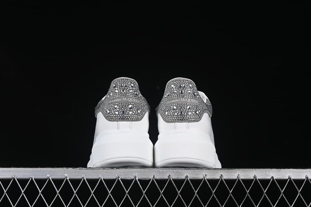 Rear view of the pair highlighting the embellished heel tabs.