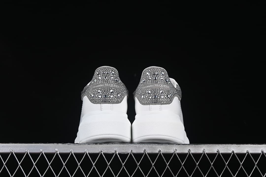 Rear view of the pair highlighting the embellished heel tabs.