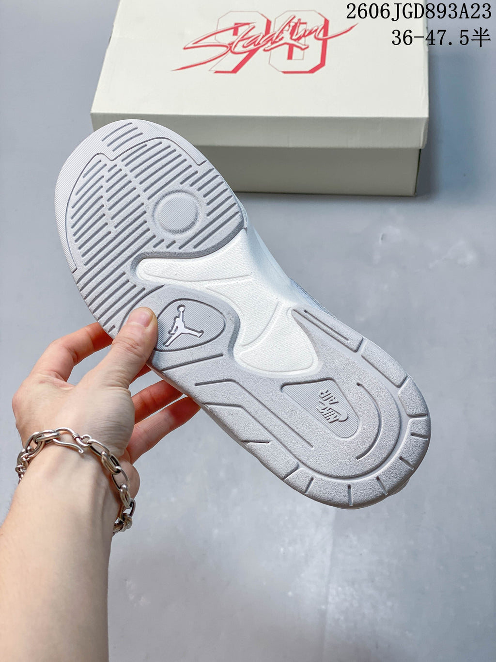 Underside of a Jordan Stadium 90 sneaker showing the sculpted outsole and tread
