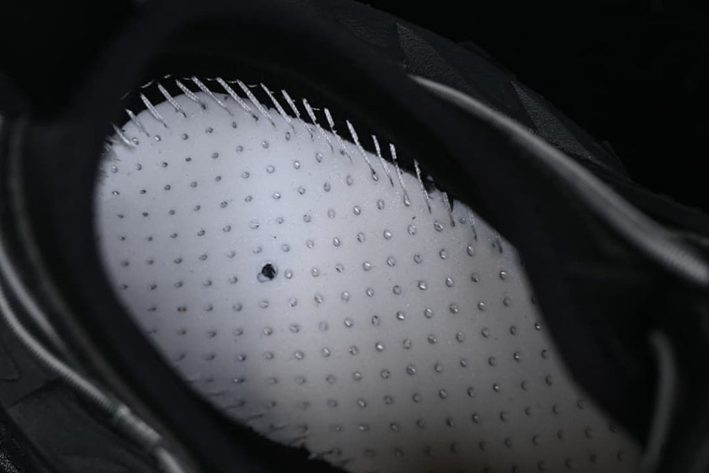 Close-up of the sneaker interior and perforated insole.
