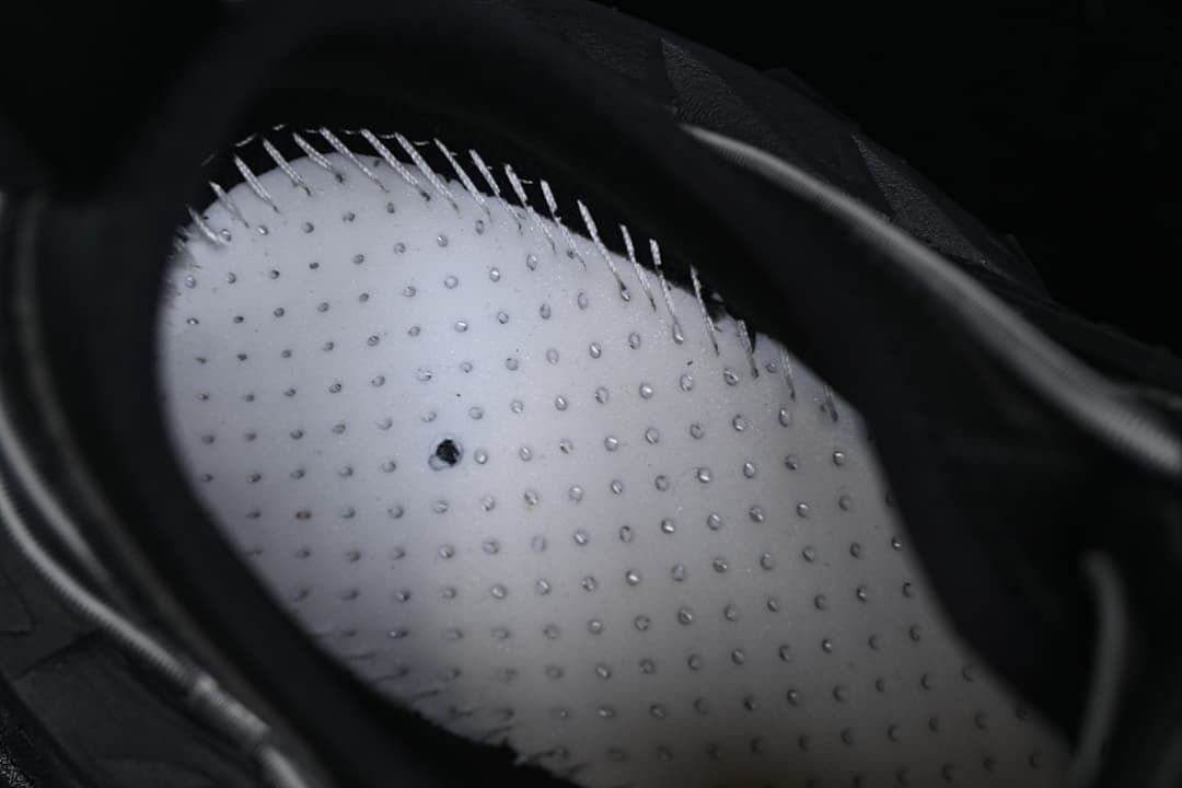 Close-up of the sneaker interior and perforated insole.