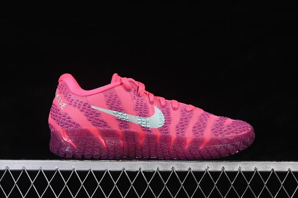 Side view of a shoe showing the patterned upper and light-colored Swoosh