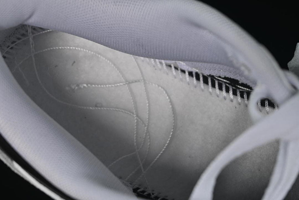Close-up view inside the sneaker showing the lining and stitching