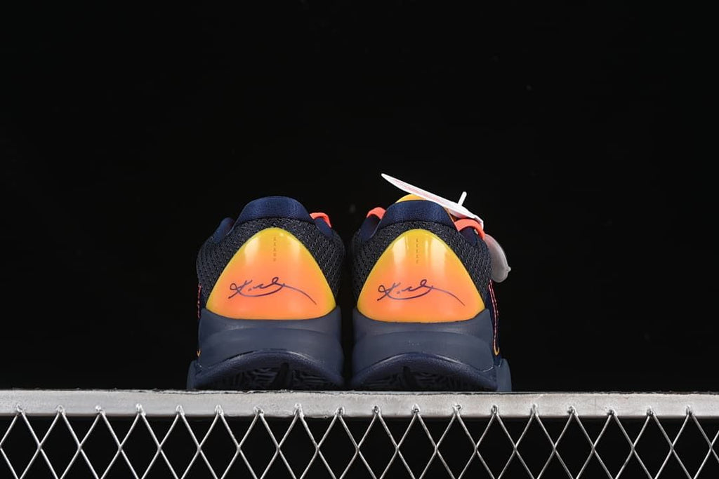 Rear view of both shoes with yellow-orange heel panels.