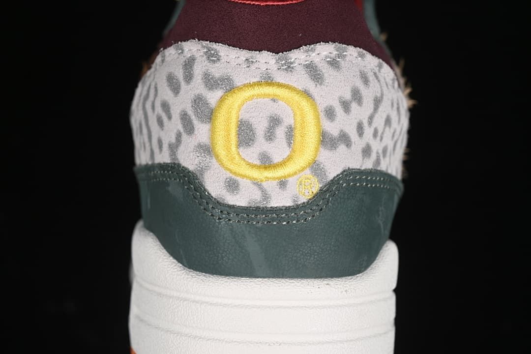 Rear view showing the patterned heel panel and yellow embroidered detail.