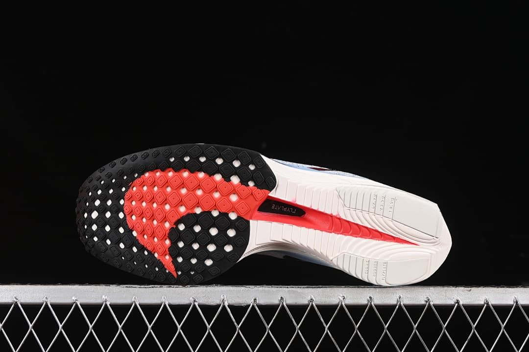 Outsole view showing black and red tread sections