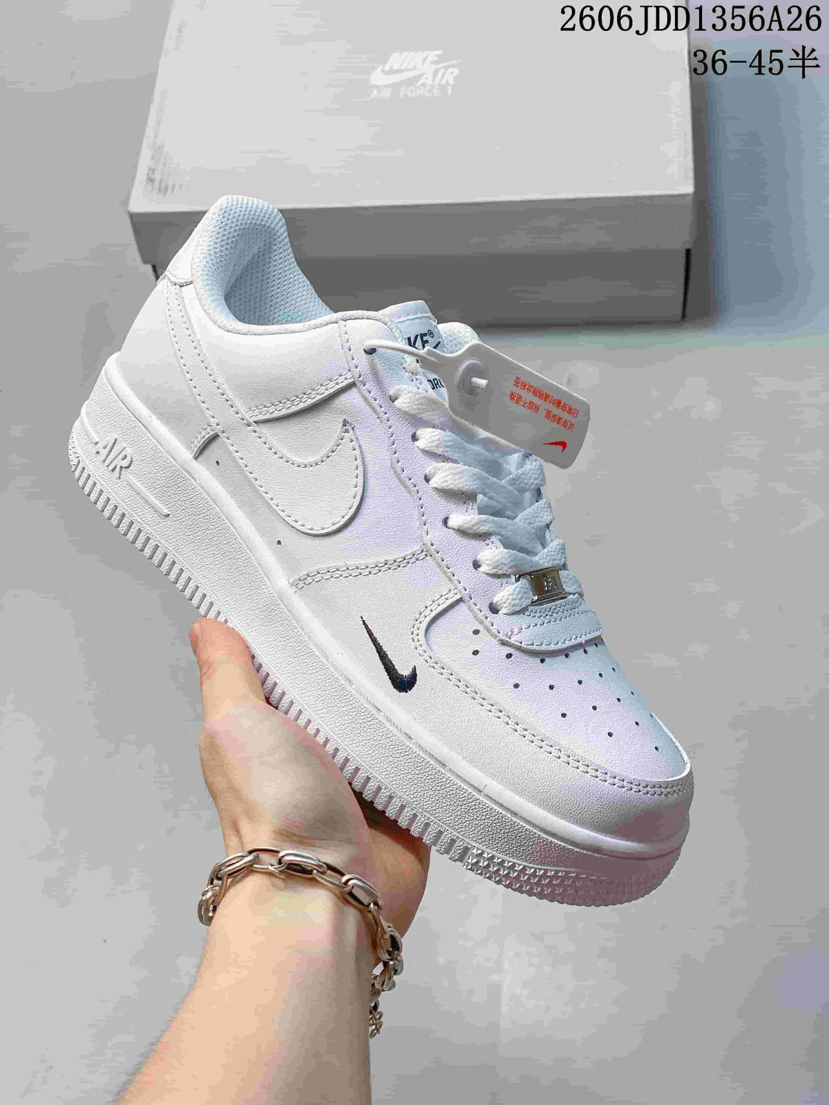 White Nike Air Force 1 low-top sneaker with small black Swoosh detail