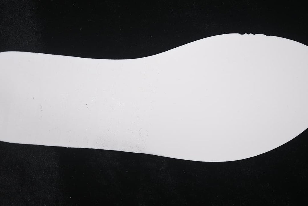 White sneaker midsole shown from the side