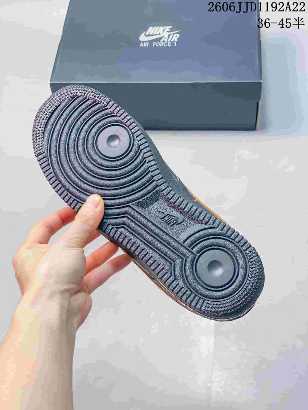 Close-up of the textured blue outsole and circular tread pattern