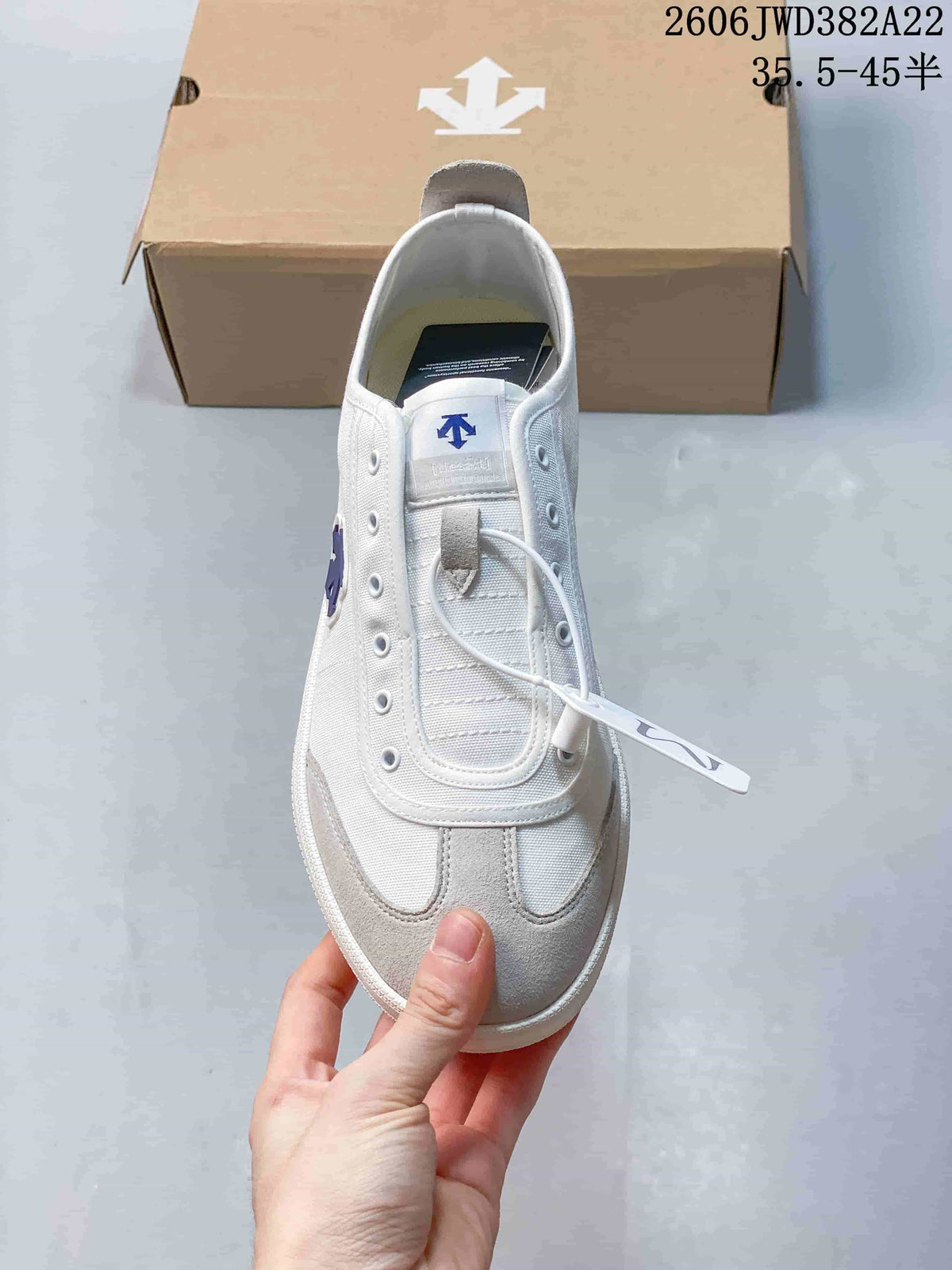 Top view showing the T-toe design, lace-up front, and blue tongue logo