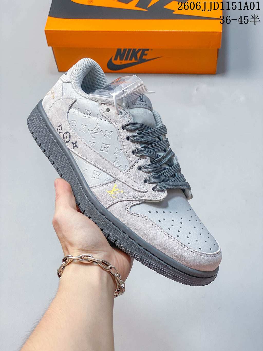 Angled side view highlighting the patterned panels, gray laces, and low-top shape