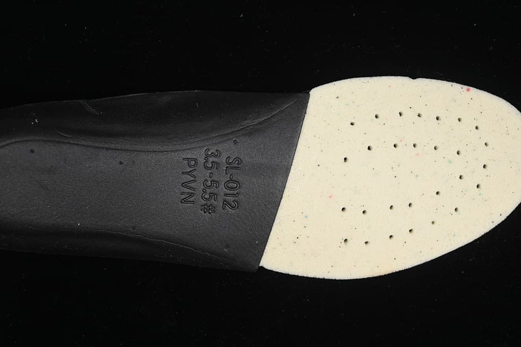 Close-up of the shoe insert underside with printed markings