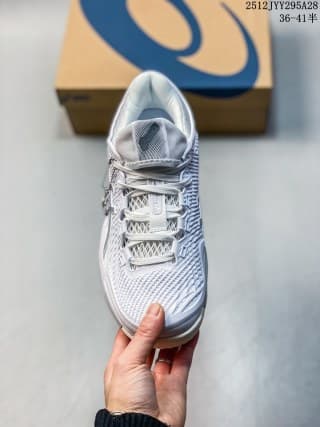 Top view of a white and light gray ASICS SKY ELITE FF 3 sneaker showing the tongue, laces, and textured forefoot.