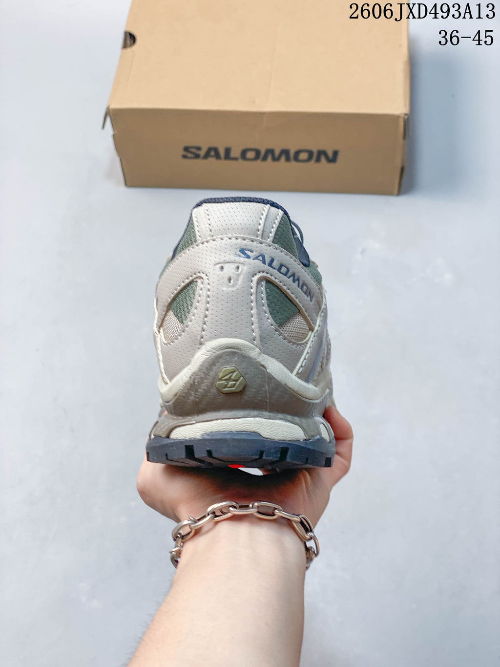 Rear view of a Salomon shoe showing heel panels and outsole.